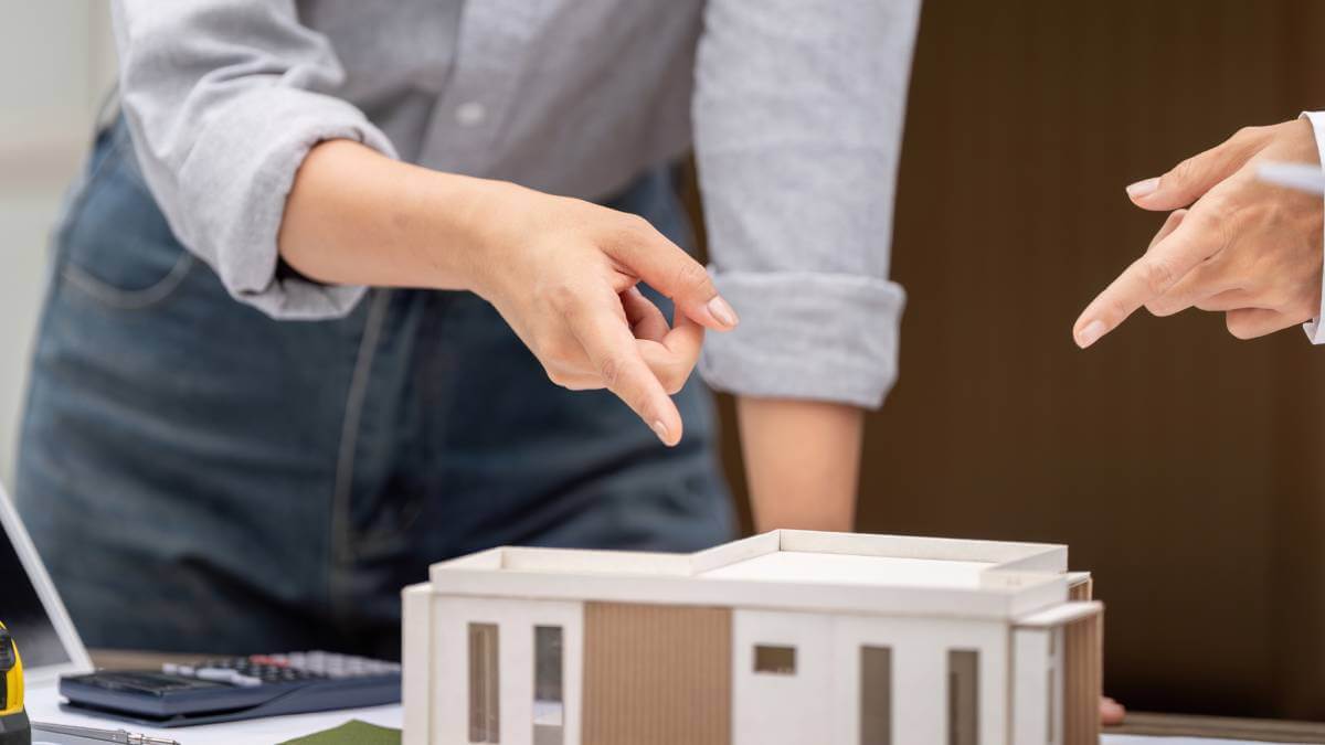 Pointing At Building Mock